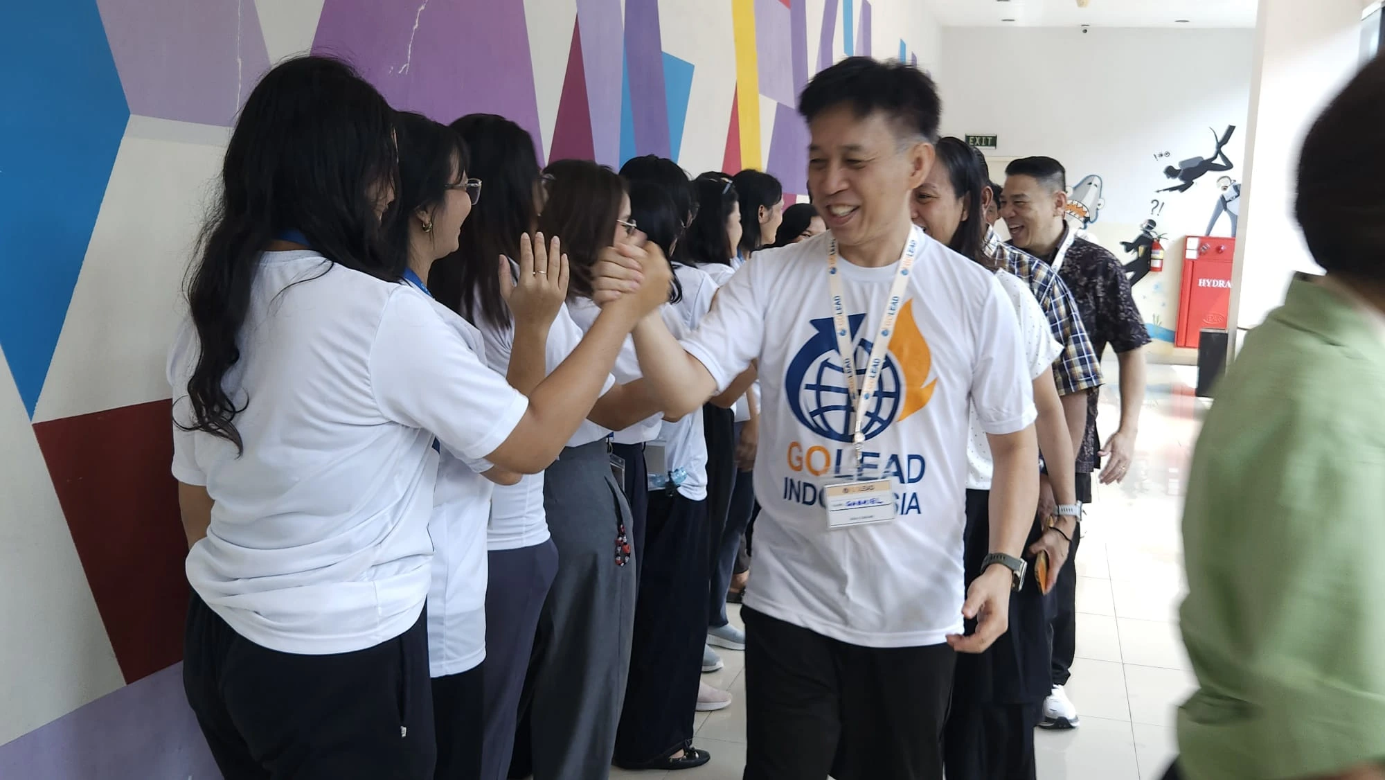 Young adults in discussion during a Bandung intensive session
